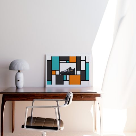 A3 print mockup in a frame on a desk - The image features a Nike Air Force 1 sneaker in an off white collaboration black MoMa colourway. The sneaker is presented on a mondrian inspired background of colourful lines and squares