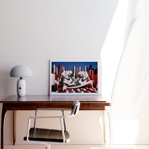 A3 print mockup in a frame on a desk - The image features a Nike Air Jordan 1 high with the Union Skateboards LA collaboration. The sneakers are sat in a CGI background made up of colourful blocks of different sizes and shape. We make art that makes sneakerheads happier.