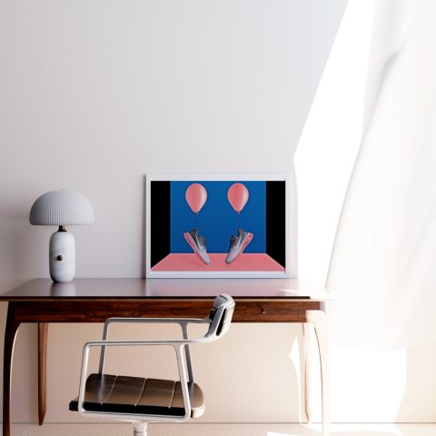 A3 print mockup in a frame on a desk - The image features a Nike Air Max 2017 sneaker in a platinum and pink colourway. The sneakers are tied to balloons which appear to be floating.